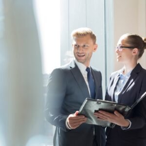 Businessman and businesswoman preparing for meeting