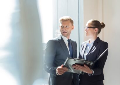 Businessman and businesswoman preparing for meeting