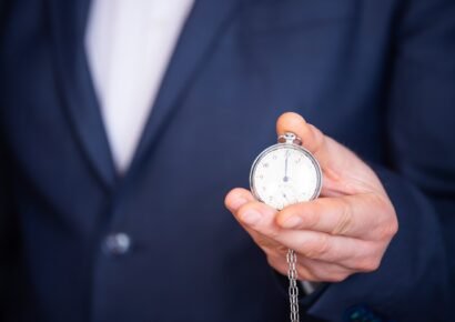 Businessman with clock in time concept