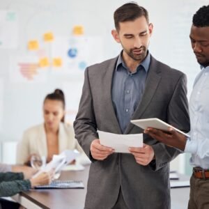 Consulting mentor, business men with a tablet and office employees work on creative design, digital