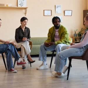 Group of people sitting at psycho session