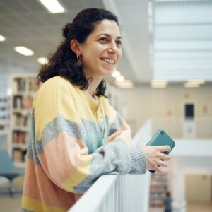 Library, happy student or intelligent woman with research goals, vision for success and excited for